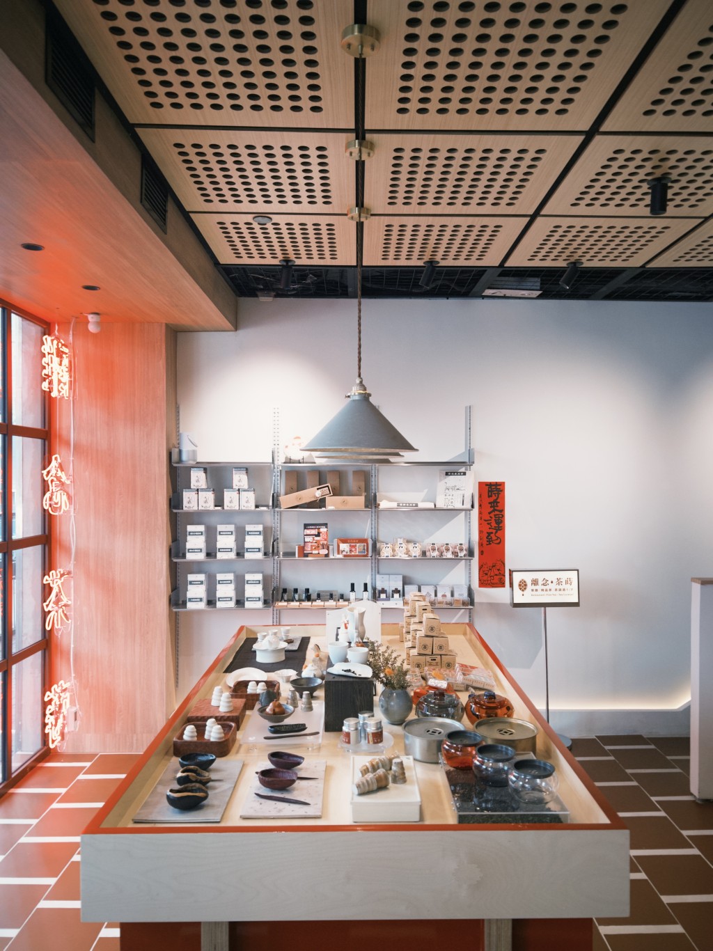 The retail selection on the ground floor includes premium tea cakes, gift boxes under THE CHAS label, locally made incense, tea-scented home fragrances and daily batches of tea-infused pastries.