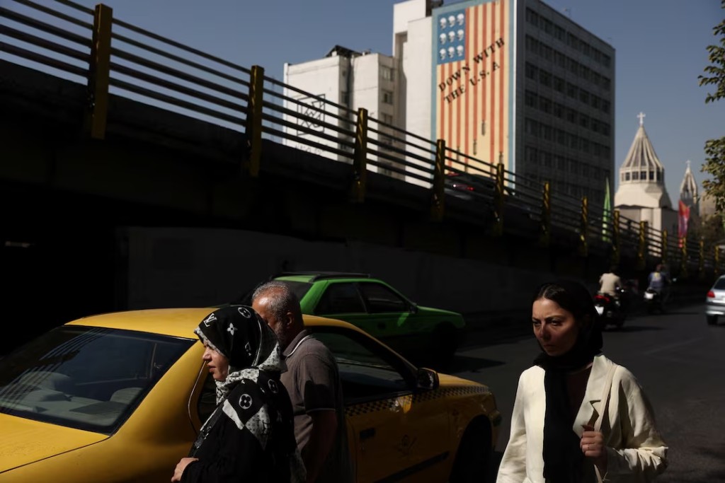  People walk near an anti-U.S. mural in Tehran, Iran, September 2, 2026. Majid Asgaripour/WANA (West Asia News Agency) via REUTERS