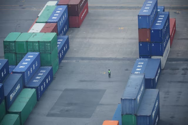 A worker walks among shipping containers at Pyeongtaek port in Pyeongtaek, South Korea, April 2, 2025. REUTERS/Kim Hong-Ji/File photo A worker walks among shipping containers at Pyeongtaek port in Pyeongtaek, South Korea, April 2, 2025. REUTERS/Kim Hong-Ji/File photo