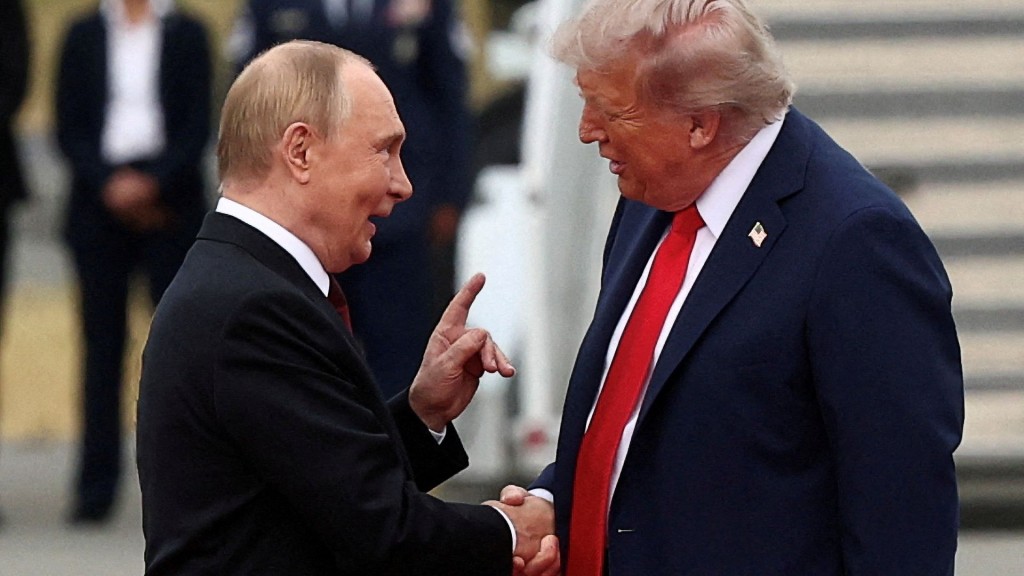 FILE PHOTO: U.S. President Donald Trump shakes hand with Russian President Vladimir Putin. Reuters