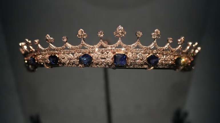 The small crown of Queen Victoria, designed by Prince Albert and crafted by Joseph Kitching, London, 1840–1842, set with sapphires and diamonds in gold and silver is displayed at the exhibition "Dynastic Jewels" organized by The Al Thani Collection at the Hôtel de la Marine museum in Paris, France, Monday, Dec. 8, 2025. Credit: AP/Michel Euler