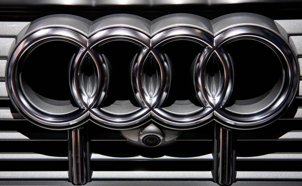Audi logo is seen on the radiator grill of an Audi e-tron electric car. John MACDOUGALL / AFP