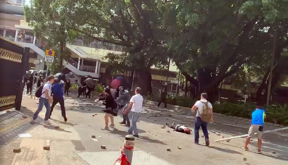 Sheung Shui residents and black-clad protesters throw bricks and debris at each other on Wednesday, November 13, 2019. File photo. Sheung Shui residents and black-clad protesters throw bricks and debris at each other on Wednesday, November 13, 2019. File photo.