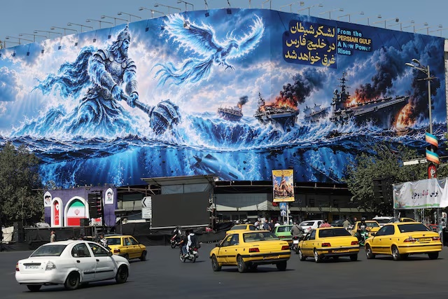 People drive past a billboard about the Strait of Hormuz, on a building in Tehran, Iran, September 16, 2026. Majid Asgaripour/WANA (West Asia News Agency) via REUTERS
