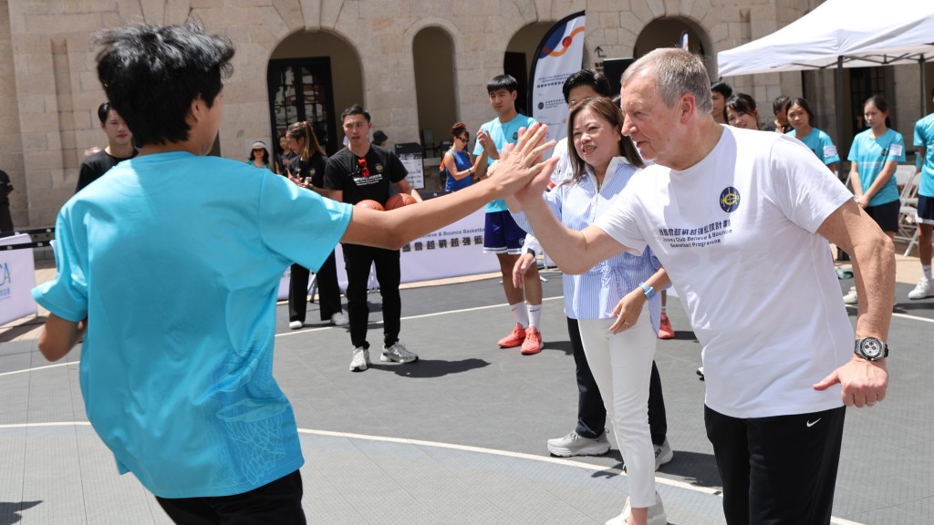 Officiating guests interact with young people at the launch ceremony for the Jockey Club Believe & Bounce Basketball Programme. Officiating guests interact with young people at the launch ceremony for the Jockey Club Believe & Bounce Basketball Programme.