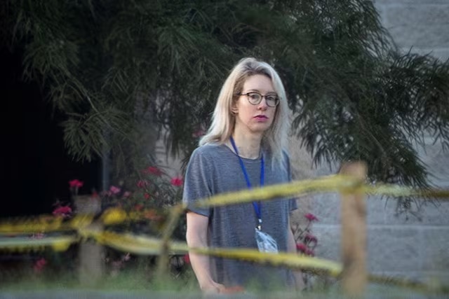 Theranos founder Elizabeth Holmes walks on the grounds of the Federal Prison Camp in Bryan, Texas, U.S., August 3, 2025. REUTERS/Adrees Latif