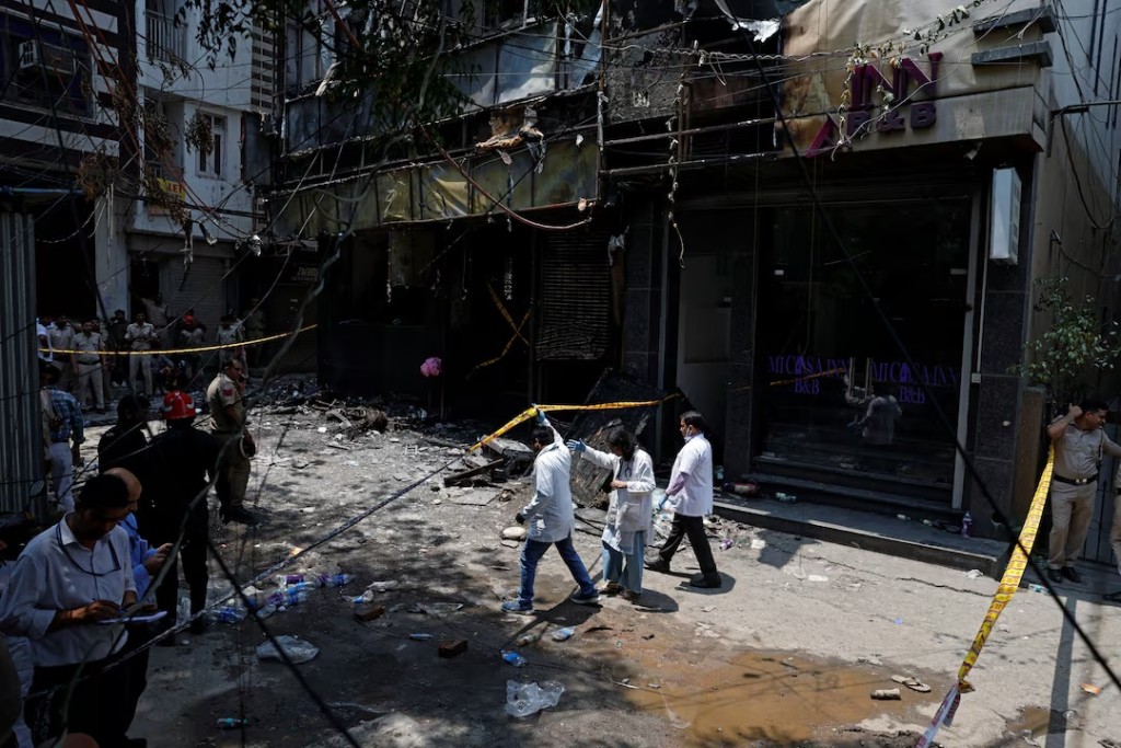 A medical team arrives at the site after a fire at a hotel in New Delhi, India, June 3, 2026. REUTERS/Adnan Abidi