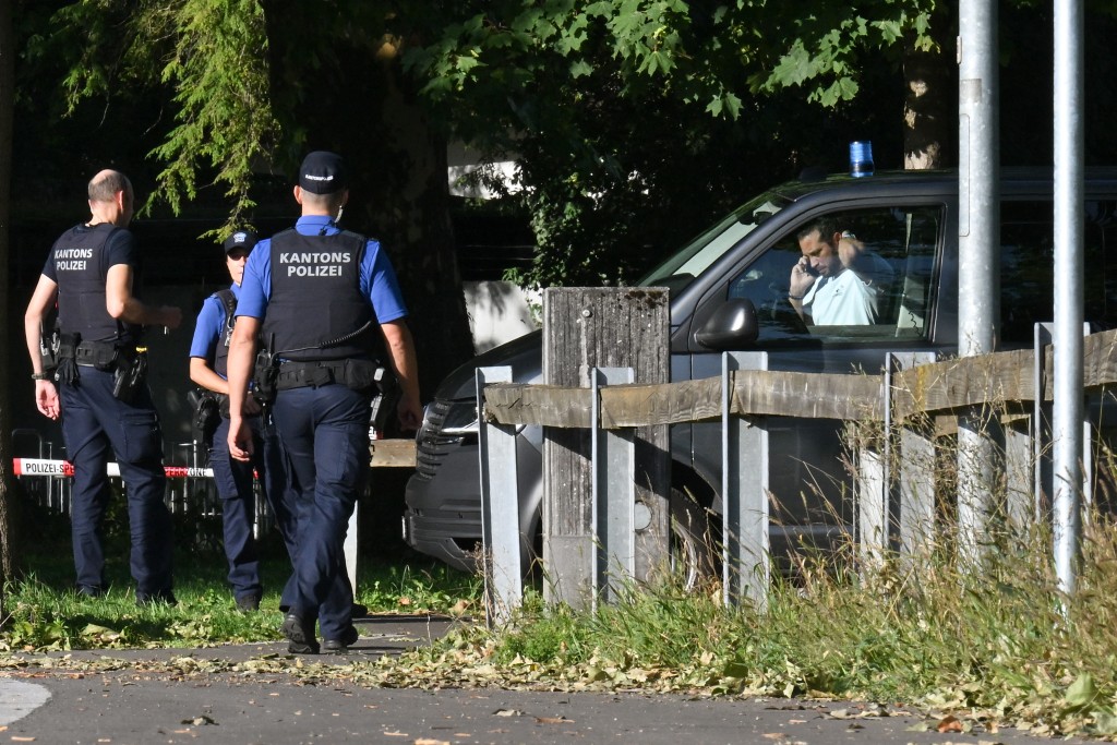 Police officers secure the area where a shooting occurred, in Aarau, northern Switzerland, on 30 August 2026. (AFP)