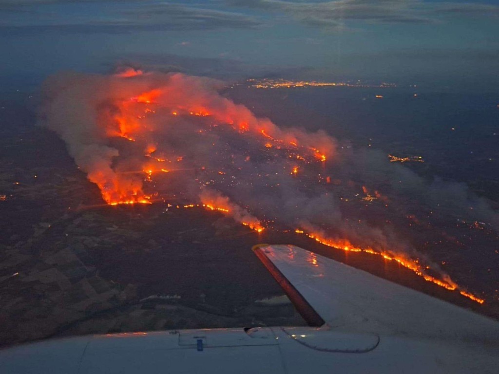This aerial photograph taken on board a French Civil Security aircraft on August 6, 2025 and released on August 7, 2025 by the Sécurité civile shows the fire raging in the department of Aude, near Ribaute and Saint-Laurent-de-la-Cabrerisse, in the south of France. (AFP)