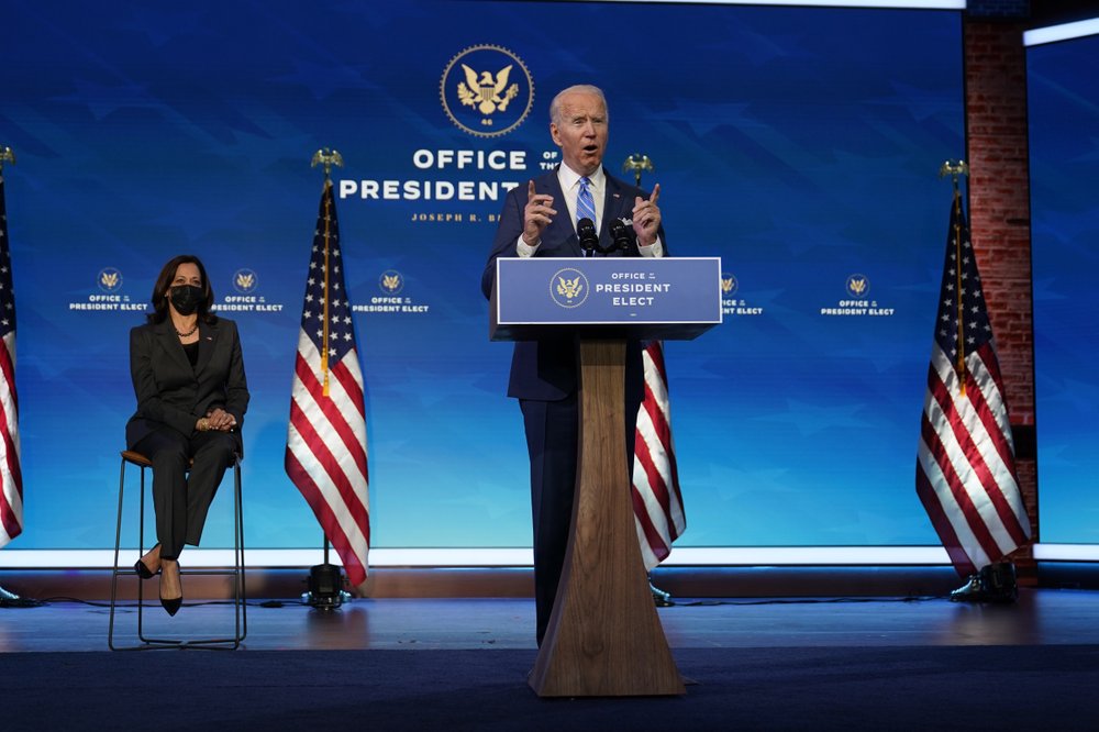 President-elect Joe Biden speaks about the pandemic during an event at The Queen theater, Thursday, January 14, 2021, in Wilmington, Delaware, as Vice President-elect Kamala Harris listens. President-elect Joe Biden speaks about the pandemic during an event at The Queen theater, Thursday, January 14, 2021, in Wilmington, Delaware, as Vice President-elect Kamala Harris listens.