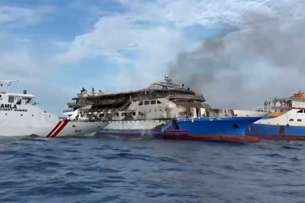 This screen grab taken from video released by Indonesia's National Search and Rescue Agency (BASARNAS) and the Indonesian Coast Guard on July 20, 2025 shows the KM Barcelona 5 ferry after a fire broke out while on its way to Manado, the capital of North Sulawesi province. (AFP)