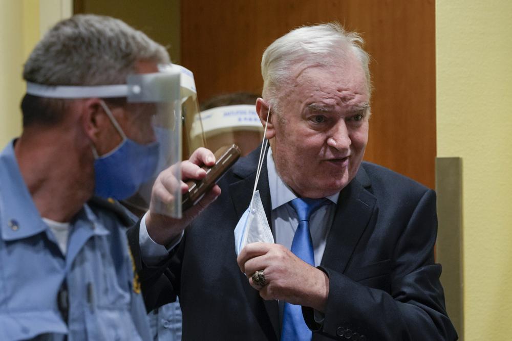 Former Bosnian Serb military chief Ratko Mladic enters the court room in The Hague, Netherlands, Tuesday, June 8, 2021, where the United Nations court delivers its verdict in the appeal of Mladic against his convictions for genocide and other crimes and his life sentence for masterminding atrocities throughout the Bosnian war. Former Bosnian Serb military chief Ratko Mladic enters the court room in The Hague, Netherlands, Tuesday, June 8, 2021, where the United Nations court delivers its verdict in the appeal of Mladic against his convictions for genocide and other crimes and his life sentence for masterminding atrocities throughout the Bosnian war.