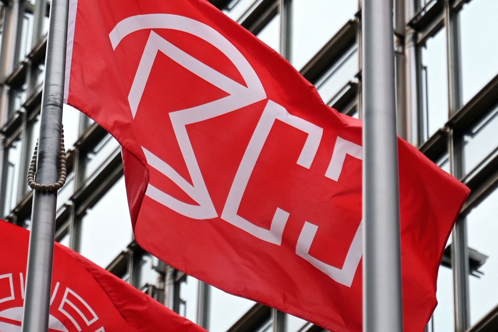 The logo of CK Hutchison is pictured on a flag outside the Cheung Kong Center building in Hong Kong on March 27, 2025. AFP