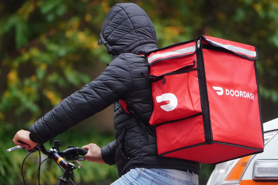 A delivery person for Doordash during the coronavirus disease pandemic in the Manhattan borough of New York City, New York, U.S., November 13, 2020. A delivery person for Doordash during the coronavirus disease pandemic in the Manhattan borough of New York City, New York, U.S., November 13, 2020.