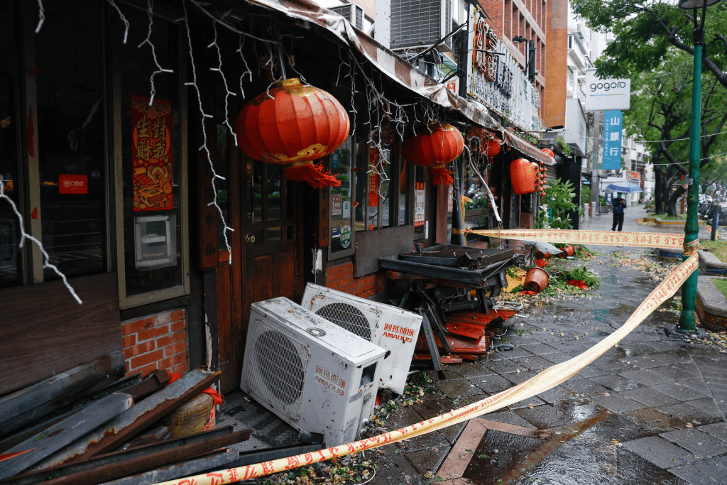 Debris lies outside a damaged restaurant after strong winds brought by Typhoon Champi, in Taipei, Taiwan October 24, 2026. REUTERS/Ann Wang