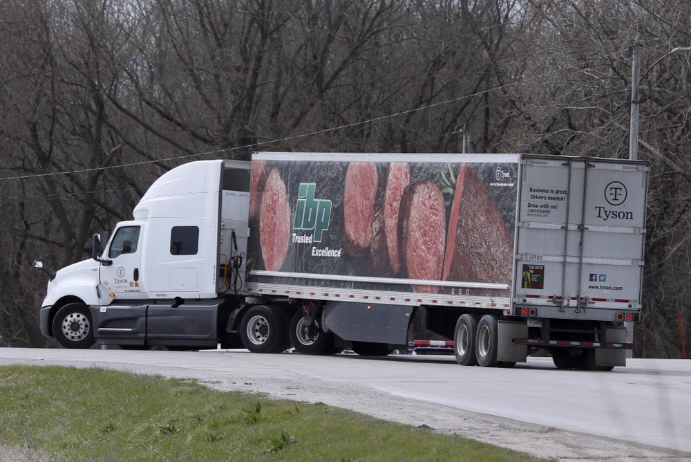 A truck leaves the Tyson Foods pork plant in Perry, Iowa. A truck leaves the Tyson Foods pork plant in Perry, Iowa.