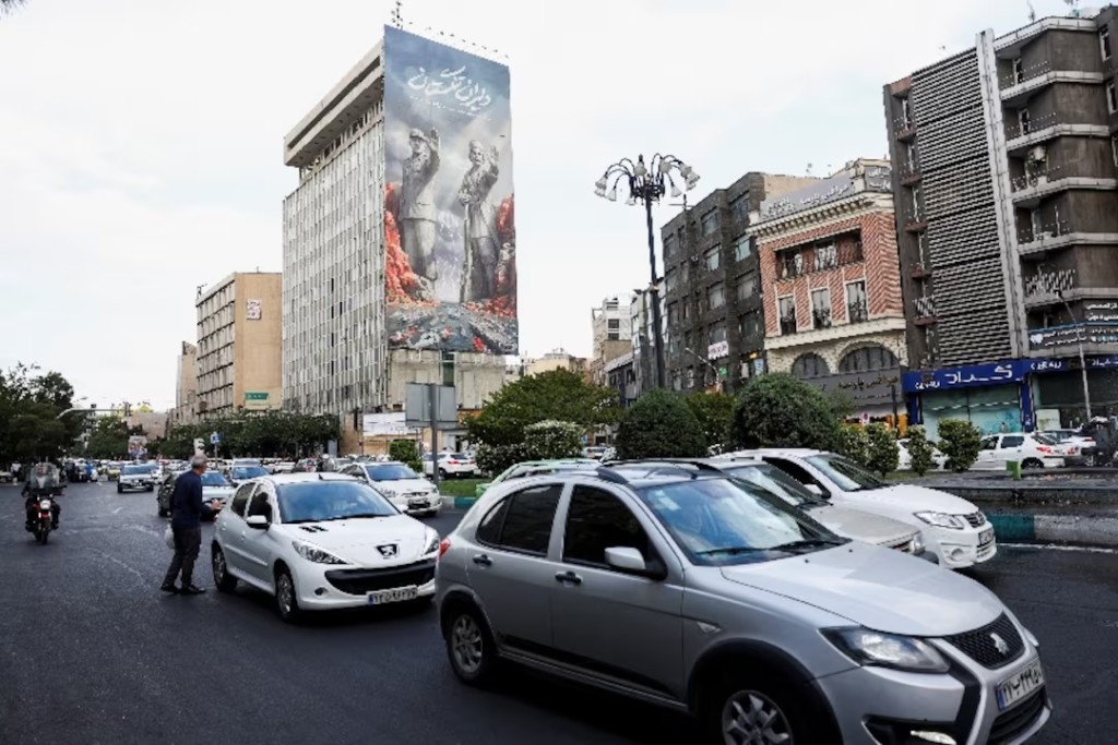 People drive past a billboard about the Strait of Hormuz, in Tehran, Iran, May 17, 2026. Majid Asgaripour/WANA (West Asia News Agency) via REUTERS