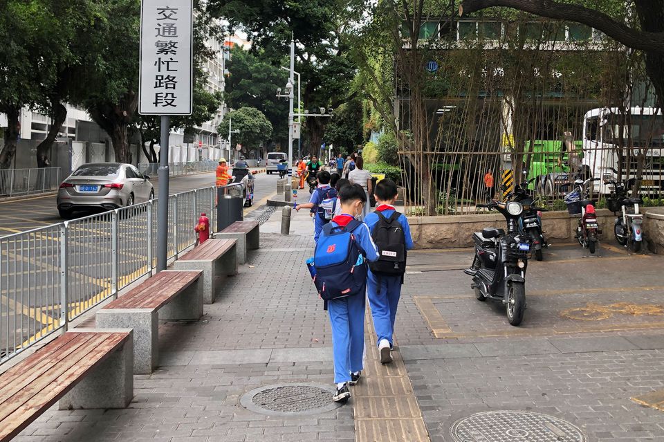 Children leave a school in Shekou area of Shenzhen, Guangdong province, China, April 20, 2021. Children leave a school in Shekou area of Shenzhen, Guangdong province, China, April 20, 2021.