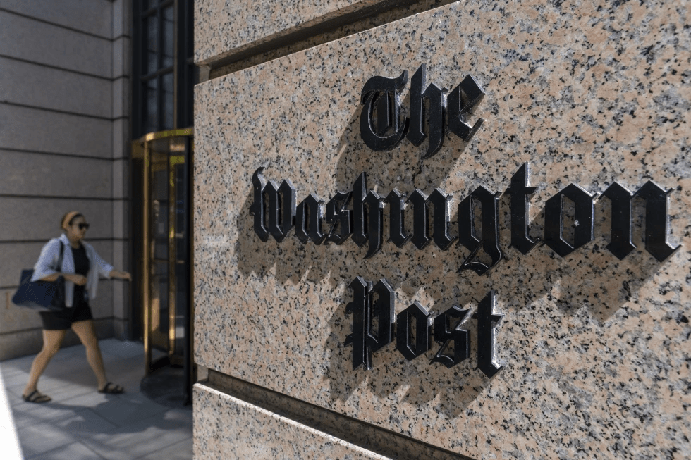 A person walks into the One Franklin Square Building, home of The Washington Post newspaper, Friday, June 21, 2024, in Washington. (AP Photo/Alex Brandon, File)