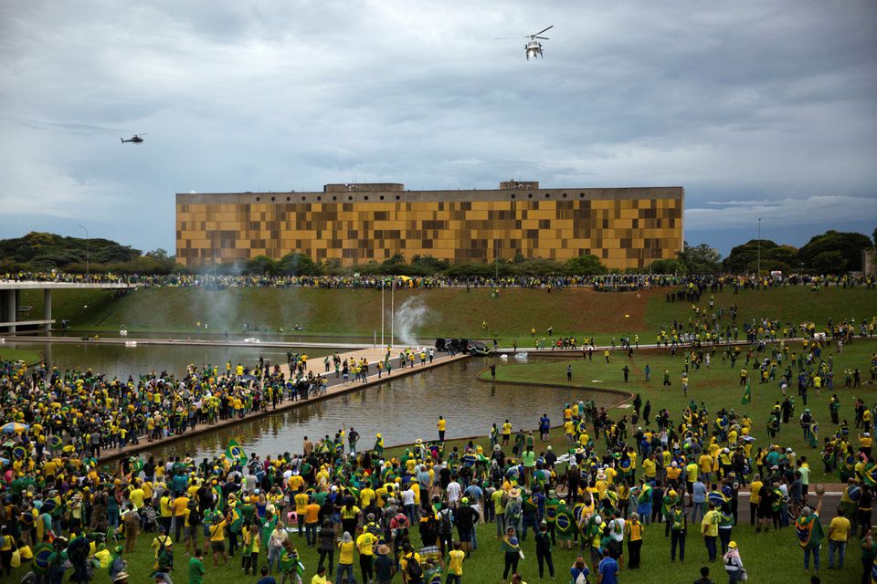 Supporters of Brazil's far-right former President Jair Bolsonaro who dispute the election of leftist President Luiz Inacio Lula da Silva gather near Brazil's Congress after protesters had invaded the building as well as the presidential palace and Supreme Court, in Brasilia, Brazil January 8, 2023. (Reuters) Supporters of Brazil's far-right former President Jair Bolsonaro who dispute the election of leftist President Luiz Inacio Lula da Silva gather near Brazil's Congress after protesters had invaded the building as well as the presidential palace and Supreme Court, in Brasilia, Brazil January 8, 2023. (Reuters)