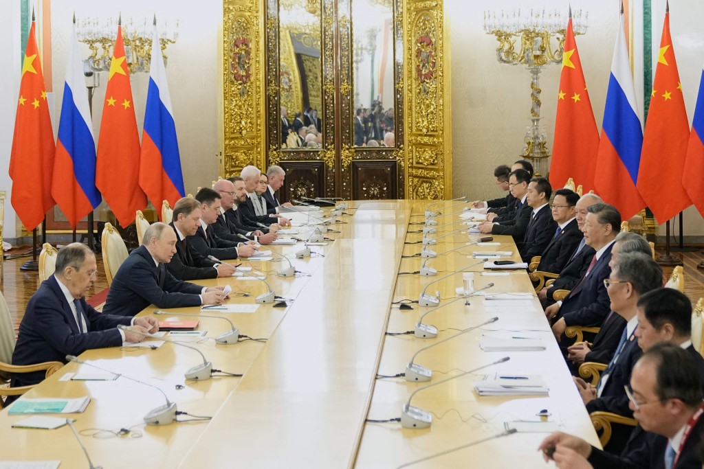 Vladimir Putin and Xi Jinping hold talks at the Kremlin in Moscow.