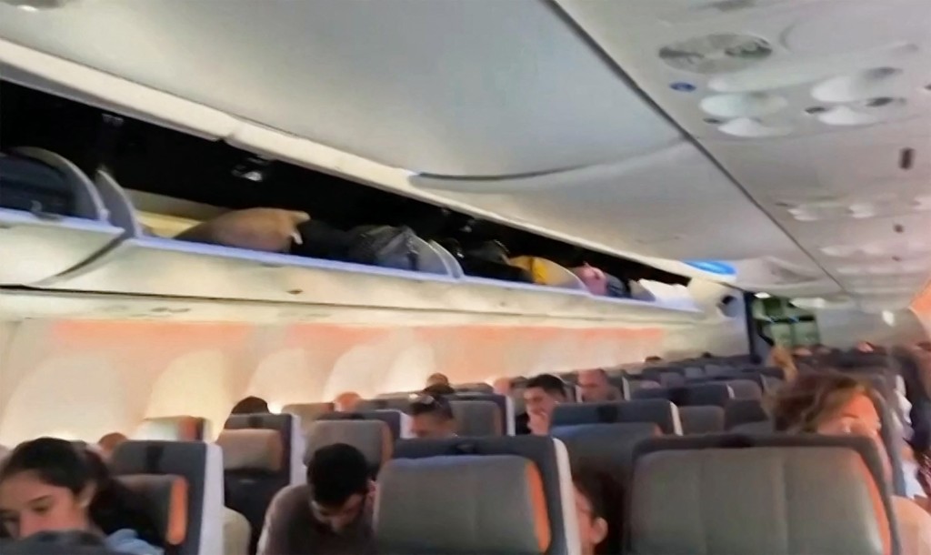 Photo by - / AFPTV / AFP This screengrab taken from a handout video footage via AFPTV on September 30, 2026 shows passengers inside the rerouted flydubai flight FZ 1073, ahead of its departure to Tel Aviv from Saudi Arabia’s Tabuk airport.