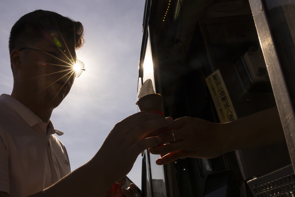 A person buys an ice cream amid the summer heat in Hong Kong, Thursday, Aug. 3, 2023. (AP)