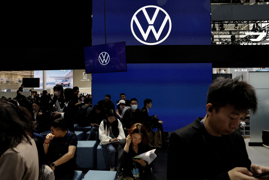 People visit the Volkswagen booth at the Beijing International Automotive Exhibition, or Auto China 2024, in Beijing, China April 25, 2024. REUTERS/Tingshu Wang/File Photo