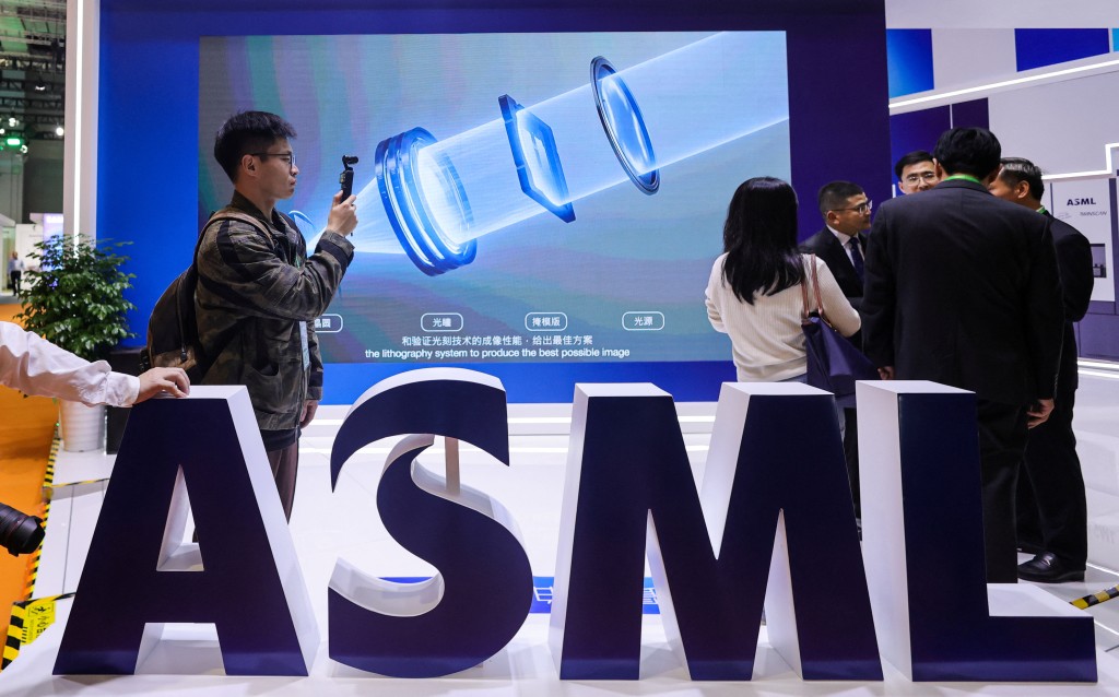 People gather at the ASML booth at the 8th China International Import Expo (CIIE) in Shanghai, China, November 5, 2025. (Reuters)