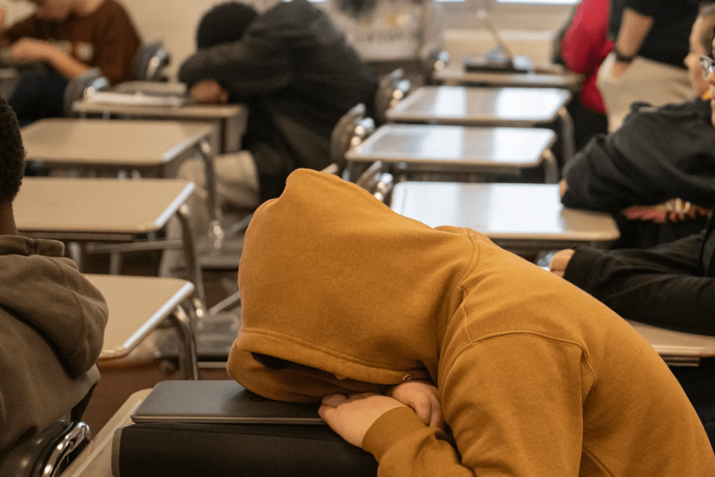 FILE – A Mansfield Senior High School student rests during his health class on sleep, in Mansfield, Ohio, Dec. 6, 2024. (AP Photo/Phil Long)