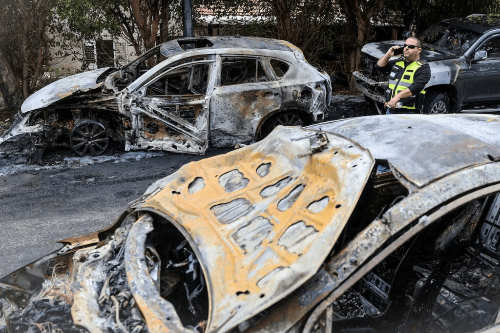 Burnt out cars at the site where damage was caused following the launch of barrages of Iranian missiles towards Israel, amid the U.S.-Israel conflict with Iran, in Kiryat Ono, Israel March 26, 2026. REUTERS/Oren Ben Hakoon