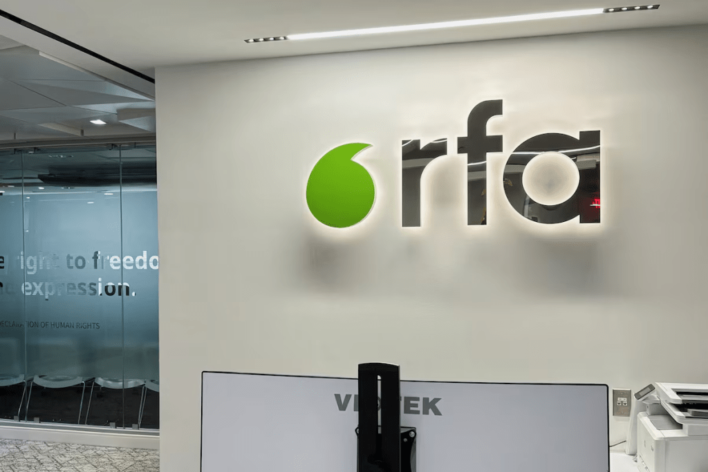 A logo of Radio Free Asia is displayed in its office, following the termination of funding for RFA, which broadcasts in nine Asian languages, a day after U.S. President Donald Trump signed an executive order gutting the government-funded media outlet's parent and six other federal agencies, in Washington, D.C., U.S. March 15, 2025. REUTERS/Staff 