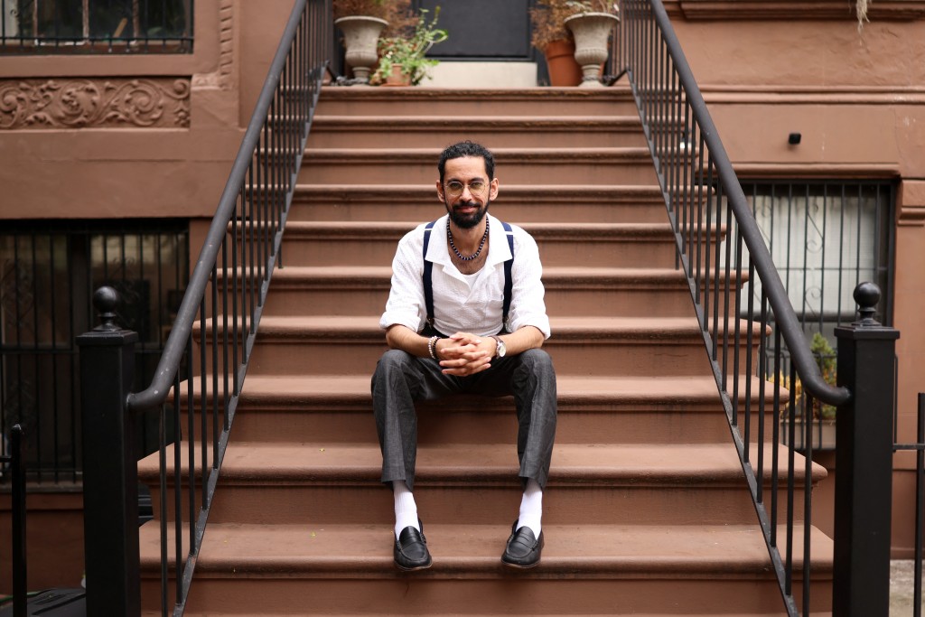 Photo by CHARLY TRIBALLEAU / AFP  Asad Dandia poses for a portrait in the Harlem area of New York on August 22, 2026.