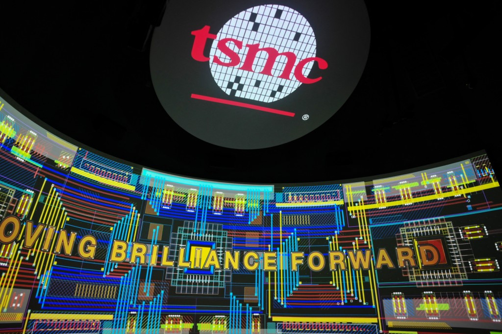 Photo by SAM YEH / AFP  The TSMC logo is seen on screens at the Taiwan Semiconductor Manufacturing Company (TSMC) Renovation Museum at the Hsinchu Science Park in Hsinchu on July 5, 2023.