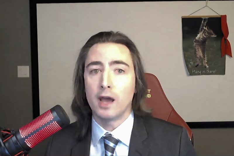 In this image from video provided by the US House Financial Services Committee, Keith Gill, a GameStop investor, also known in social media forums as Roaring Kitty, testifies during a virtual hearing on GameStop in Washington, Thursday, February 18, 2021. In this image from video provided by the US House Financial Services Committee, Keith Gill, a GameStop investor, also known in social media forums as Roaring Kitty, testifies during a virtual hearing on GameStop in Washington, Thursday, February 18, 2021.