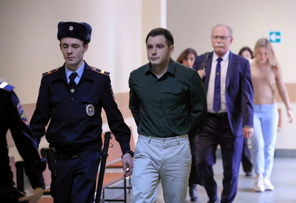U.S. ex-Marine Trevor Reed, who was detained in 2019 and accused of assaulting police officers, is escorted before a court hearing in Moscow. (Reuters) U.S. ex-Marine Trevor Reed, who was detained in 2019 and accused of assaulting police officers, is escorted before a court hearing in Moscow. (Reuters)