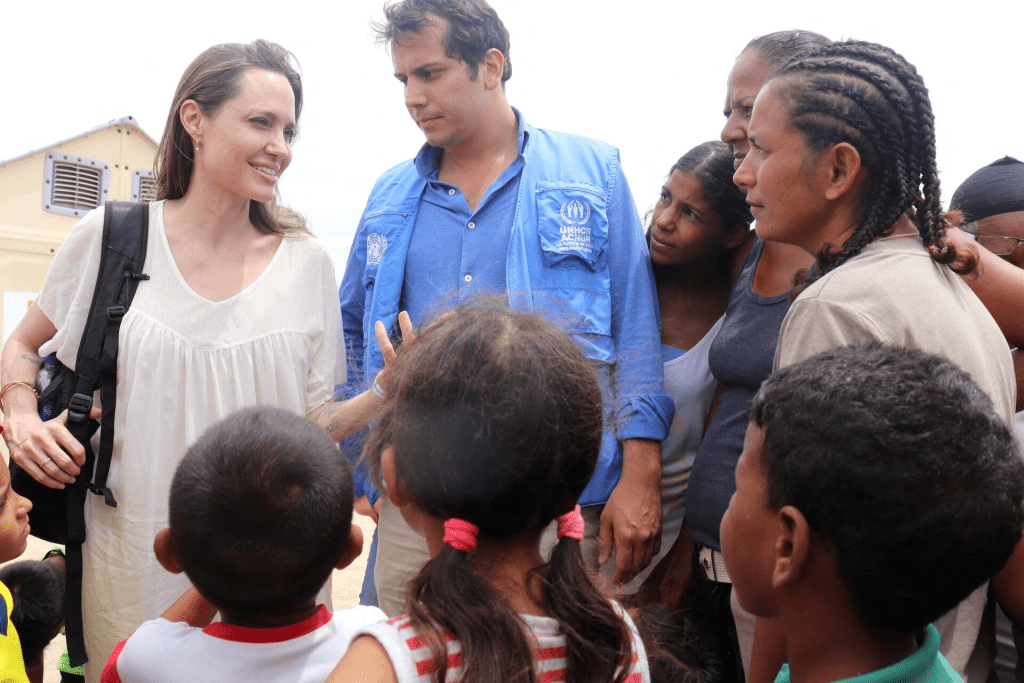 Refugee Agency's special envoy Angelina Jolie talks to people inside a camp run by the UN Refugee Agency, UNHCR, in Maicao, Colombia June 8, 2019. Courtesy of Colombian Foreign Ministry/Handout via REUTERS/File Photo