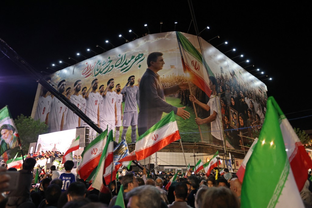 Photo by ATTA KENARE / AFP  People gather to attend the farewell ceremony of Iran's national football team ahead of their departure for the 2026 FIFA World Cup, in Tehran on May 13, 2026.