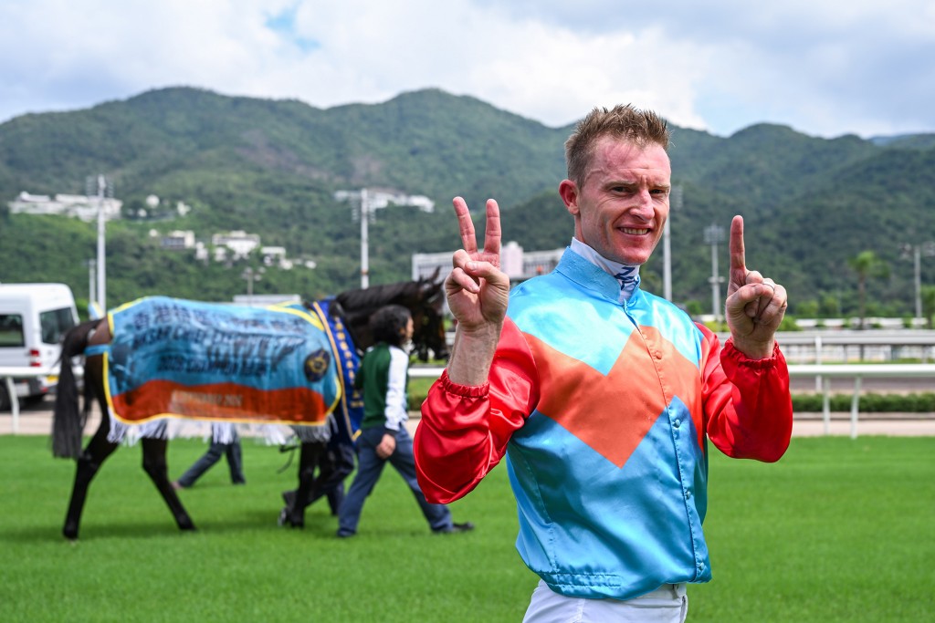 Jockey Zac Purton celebrating Ka Ying Rising's 21st consecutive win.