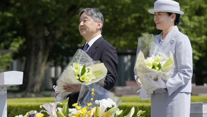 Japanese Emperor Naruhito and Empress Masako offer flowers at the cenotaph dedicated to the victims of the atomic bombing as they visit the Peace Memorial Park in Hiroshima, western Japan Thursday, June 19, 2025. (Kai Naito/Kyodo News via AP)