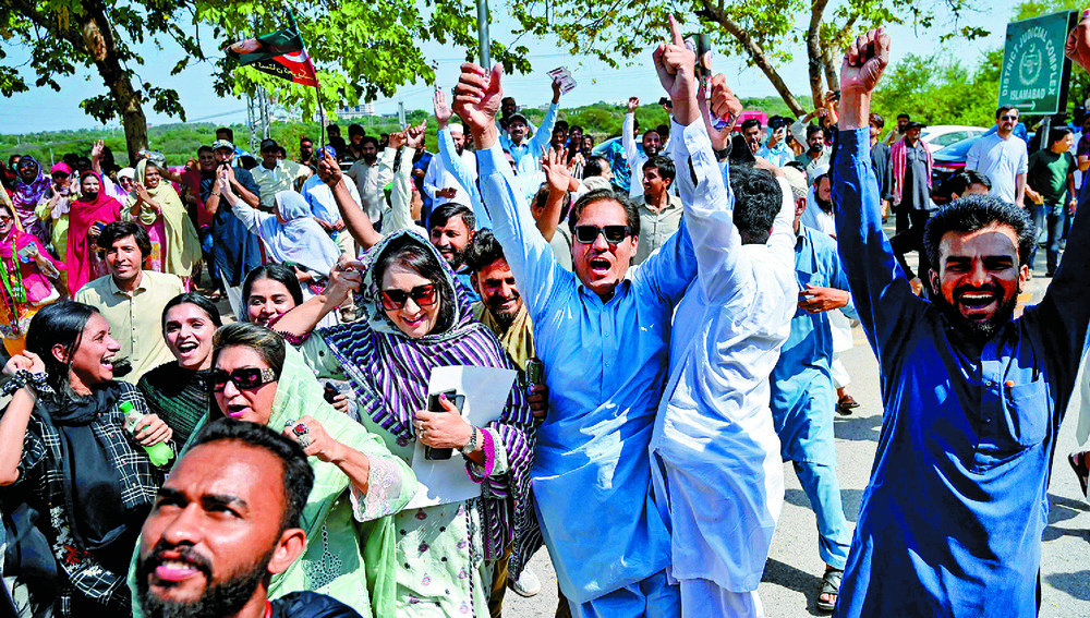 Tehreek-e-Insaf party celebrates the acquittals of Imran Khan and his wife on Saturday. AFP Tehreek-e-Insaf party celebrates the acquittals of Imran Khan and his wife on Saturday. AFP
