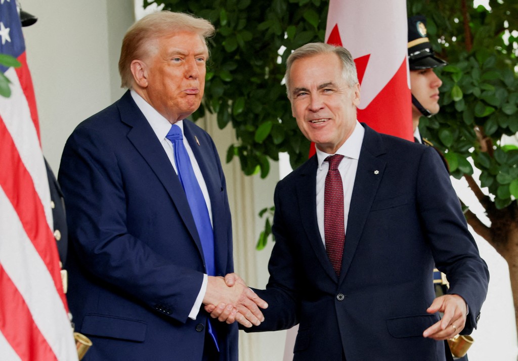 U.S. President Donald Trump welcomes Canada's Prime Minister Mark Carney at the White House in Washington, D.C., U.S., October 7, 2025. REUTERS