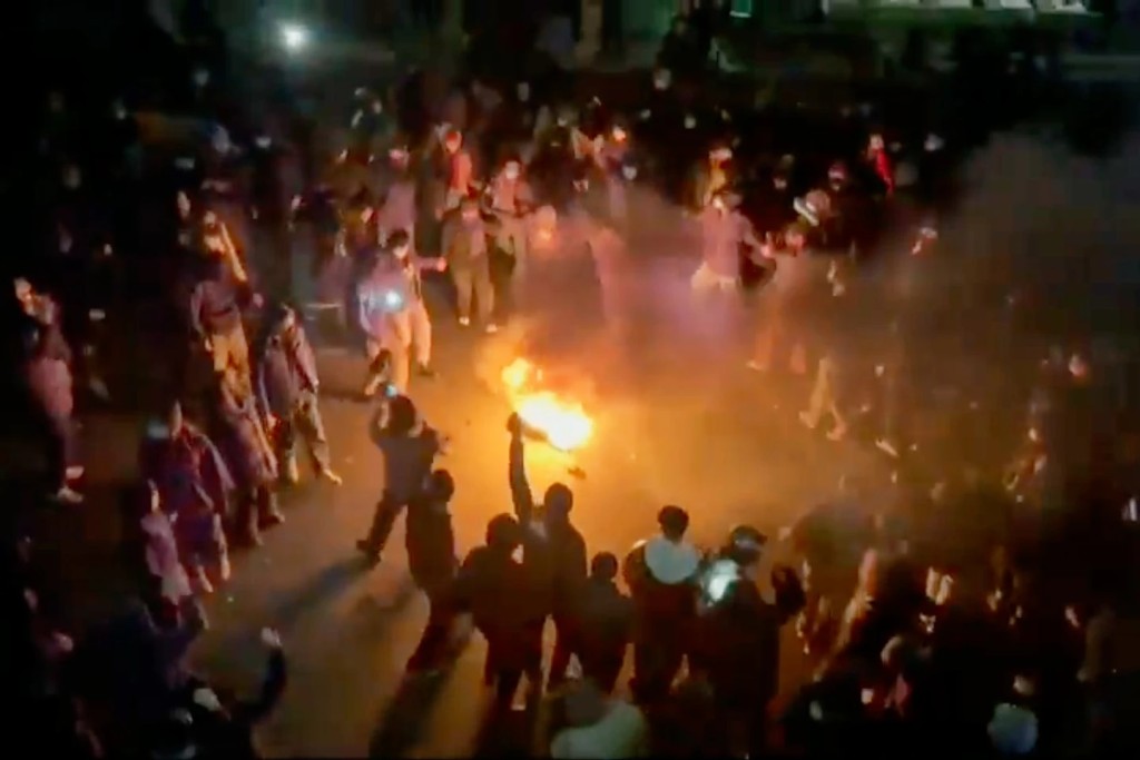 This frame grab from footage circulating on social media shows protesters dancing and cheering around a bonfire as they take to the streets despite an intensifying crackdown as the Islamic Republic remains cut off from the rest of the world, in Tehran, Iran, Jan. 9, 2026. (UGC via AP, File)