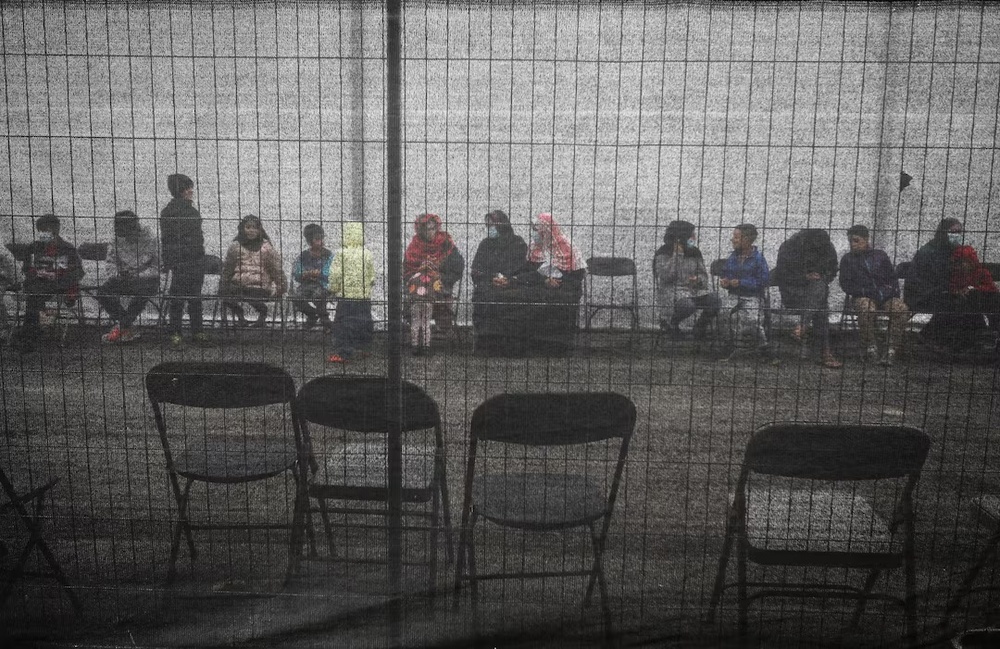 Afghan refugees queue outside a distribution and donation center at Liberty Village on Joint Base McGuire-Dix-Lakehurst in New Jersey, U.S., December 2, 2021. REUTERS/Barbara Davidson/Pool/File Photo Afghan refugees queue outside a distribution and donation center at Liberty Village on Joint Base McGuire-Dix-Lakehurst in New Jersey, U.S., December 2, 2021. REUTERS/Barbara Davidson/Pool/File Photo