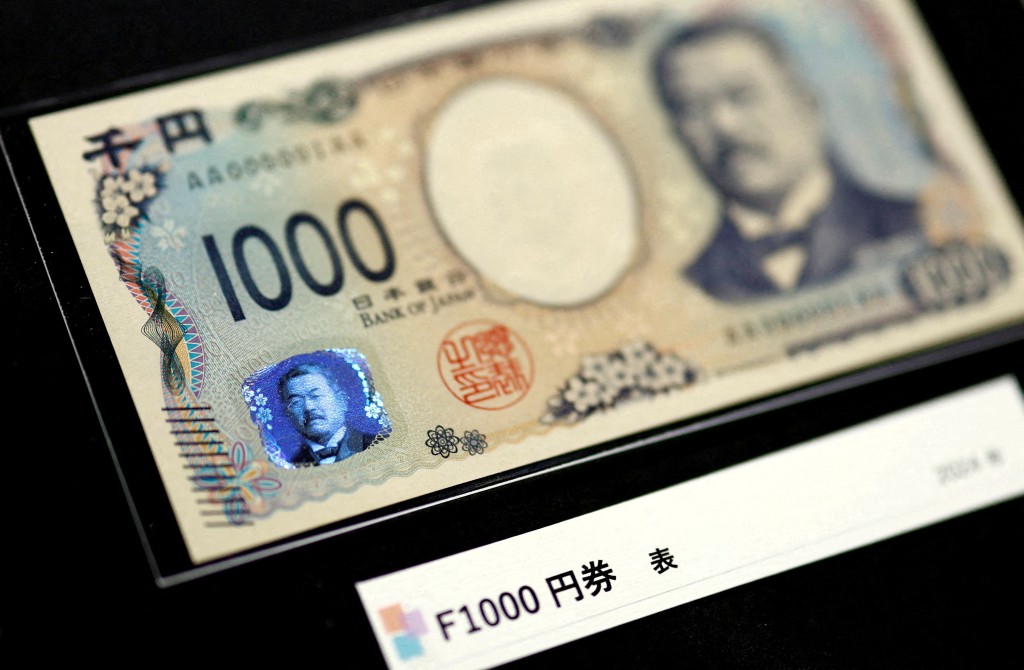Holograms, which show different images and colours depending on the angle at which they are viewed, are seen on the new Japanese 1,000 yen banknote as the new note is displayed at a currency museum of the Bank of Japan, on the day the new notes of 10,000 yen, 5,000 yen and 1,000 yen went into circulation, in Tokyo, Japan July 3, 2024. REUTERS/Issei Kato/Pool/File Photo