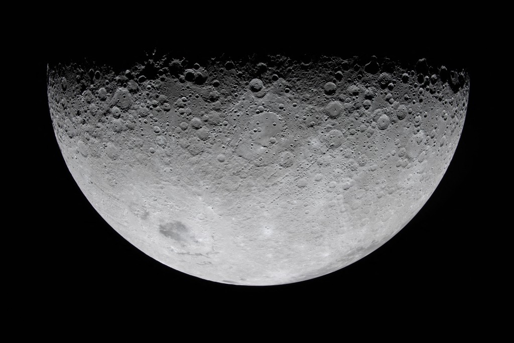 Photo by HANDOUT / NASA / AFP  This handout picture released on April 9, 2026 by NASA, shows a view of the Moon, with crater rims along the terminator –the boundary between lunar day and night– at the top of the image, photographed by the Artemis II crew from the Orion spacecraft on April 6, 2026.