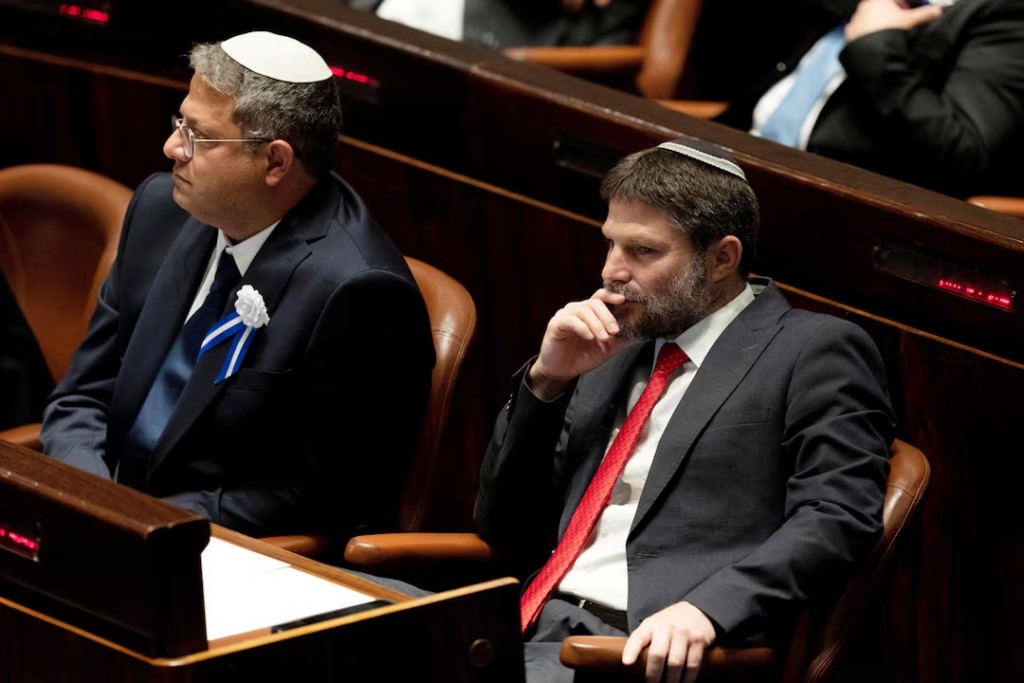  Far-right Israeli lawmakers Itamar Ben Gvir, center, and Bezalel Smotrich, right, attend the swearing-in ceremony for the new Israeli parliament, at the Knesset, or parliament, in Jerusalem, November 15, 2022. Maya Alleruzzo/Pool via REUTERS/ File Photo