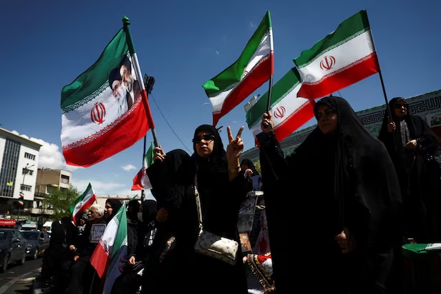 People gather after U.S. President Donald Trump said that he had agreed to a two-week ceasefire with Iran, in Tehran, Iran, April 8, 2026. Majid Asgaripour/WANA (West Asia News Agency) via REUTERS Purchase Licensing Rights