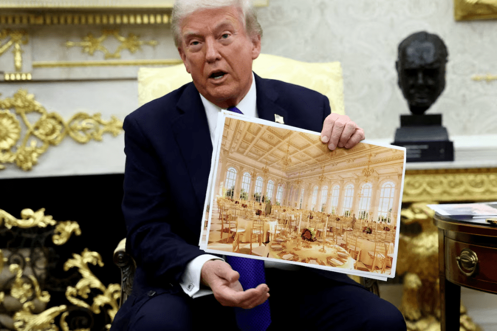 President Trump holds a rendering of the new White House ballroom to be built, October 22. REUTERS/Kevin Lamarque