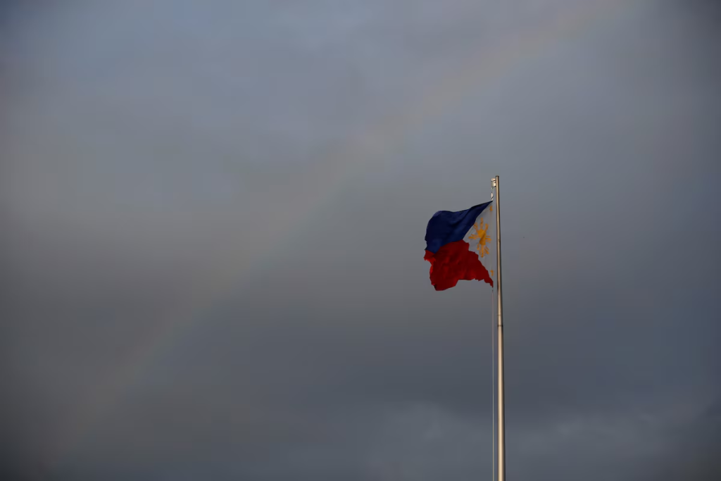 Philippines National Flag is pictured as the rainbow displays over it a day before the annual procession to celebrate Black Nazarene feast day at Quirino Grandstand in Manila, Philippines, January 8, 2020. REUTERS/Willy Kurniawan/File Photo